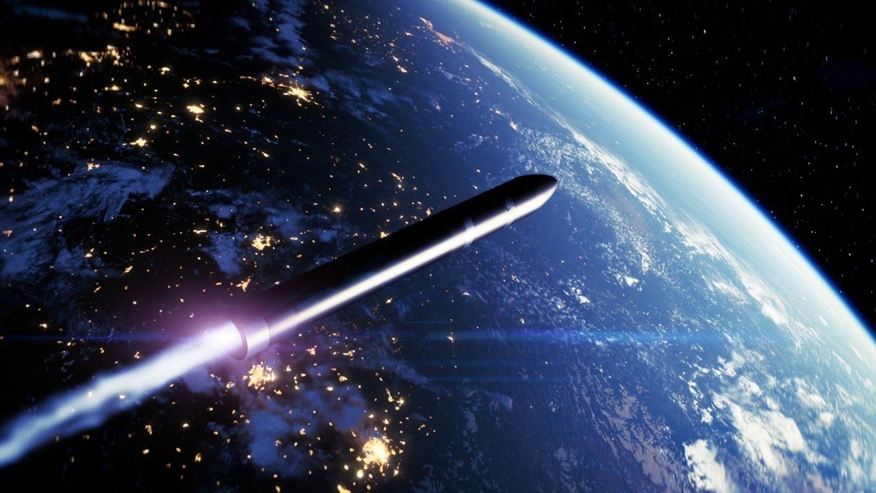 A large black interceptor soars over the planet's horizon.